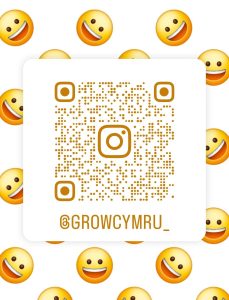 QR code with smiley faces in the background. QR code leads to Grow Cymru Instagram page.